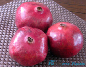 three pomegrantes