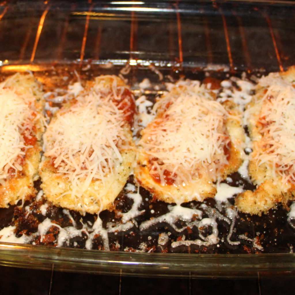 21 Day Fix approved chicken parmesan baking in the oven