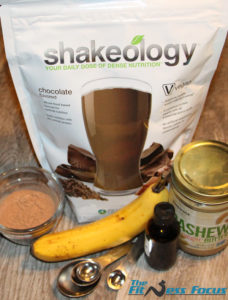 Ingredients used in this brownie recipe - Shakeology protein powder, cocoa powder, banana, vanilla extract, and cashew butter.