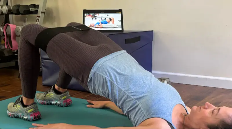 bethany doing glute bridge from 30 day booty boost workout