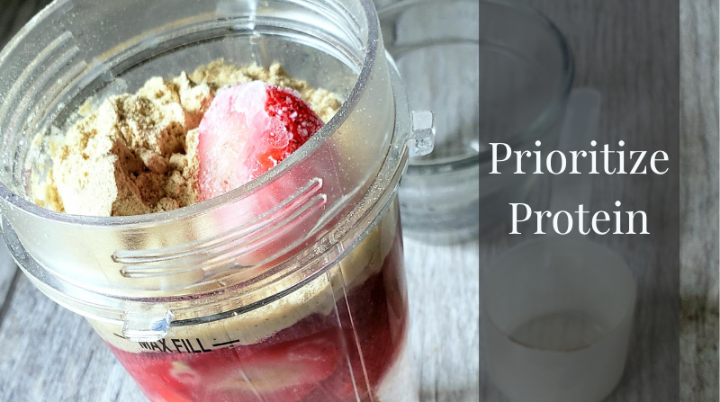 eat protein blender cup with strawberries and protein powder