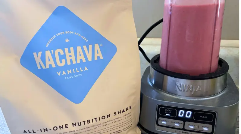 kachava bag with a mixed shake in a ninja blender on counter